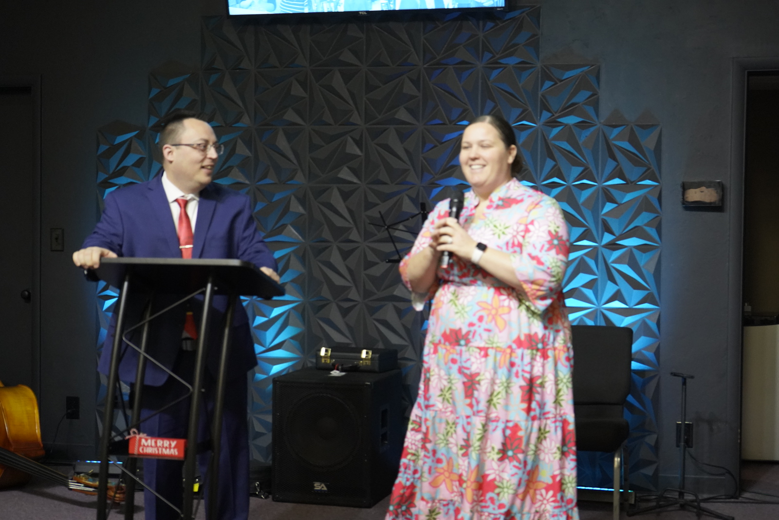 Adults sharing a joyful moment at Refuge Church