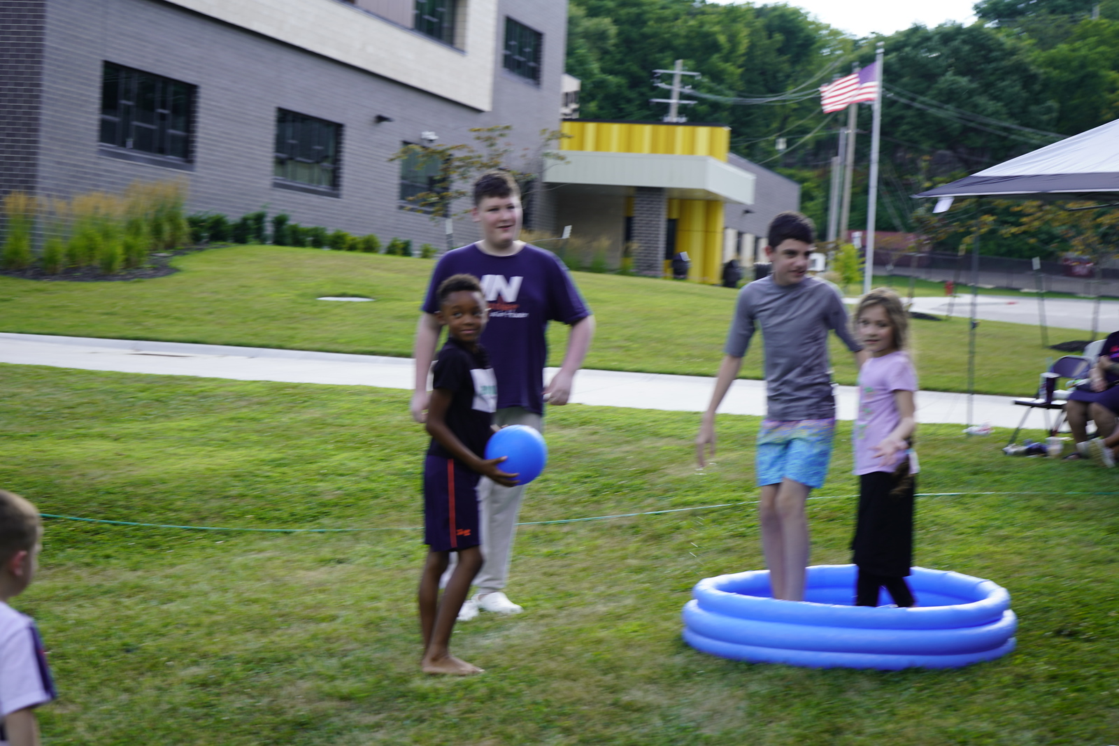 Teenagers and children enjoying a summer activity at Refuge Church
