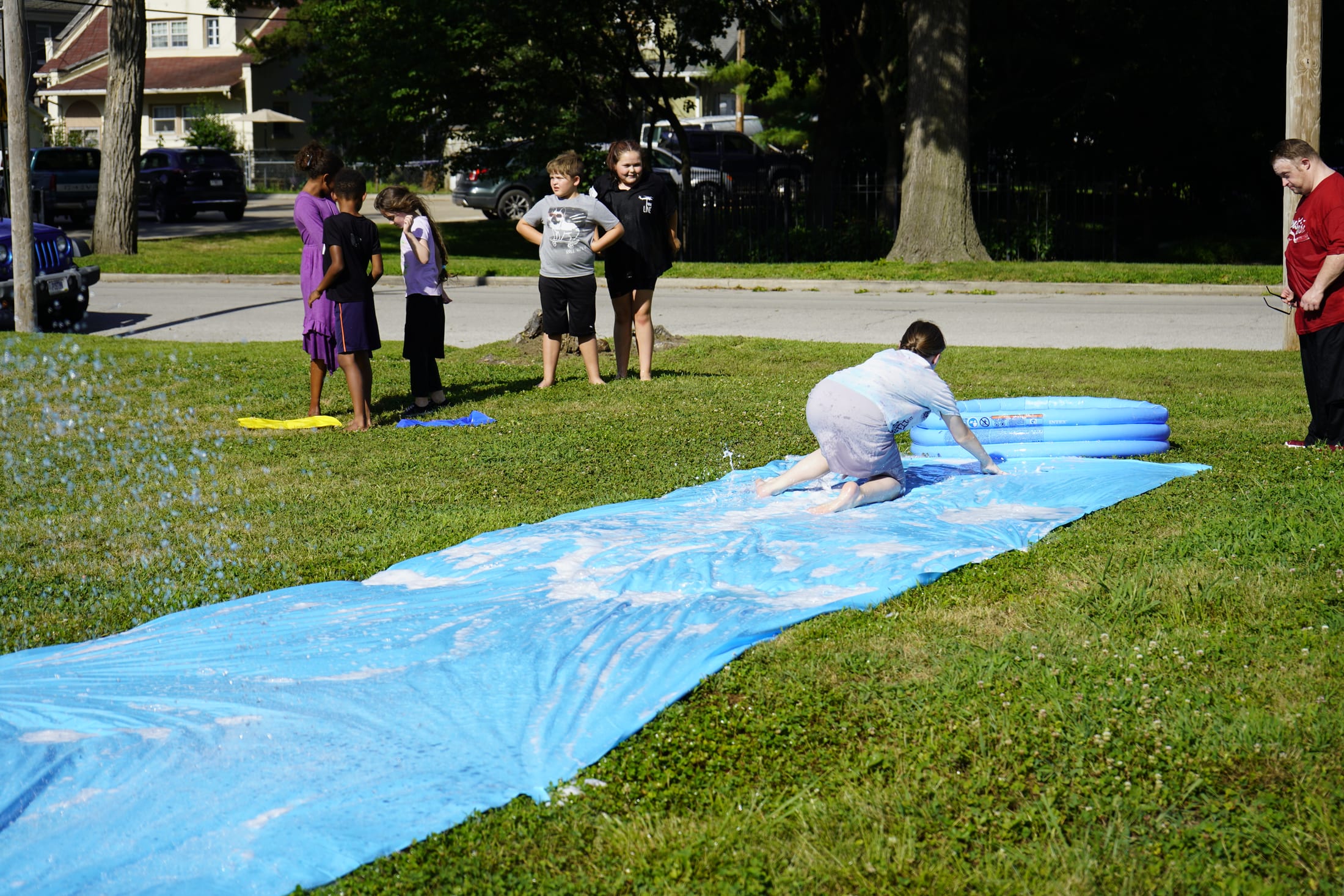 Children and families enjoying an outdoor summer event at Refuge Church