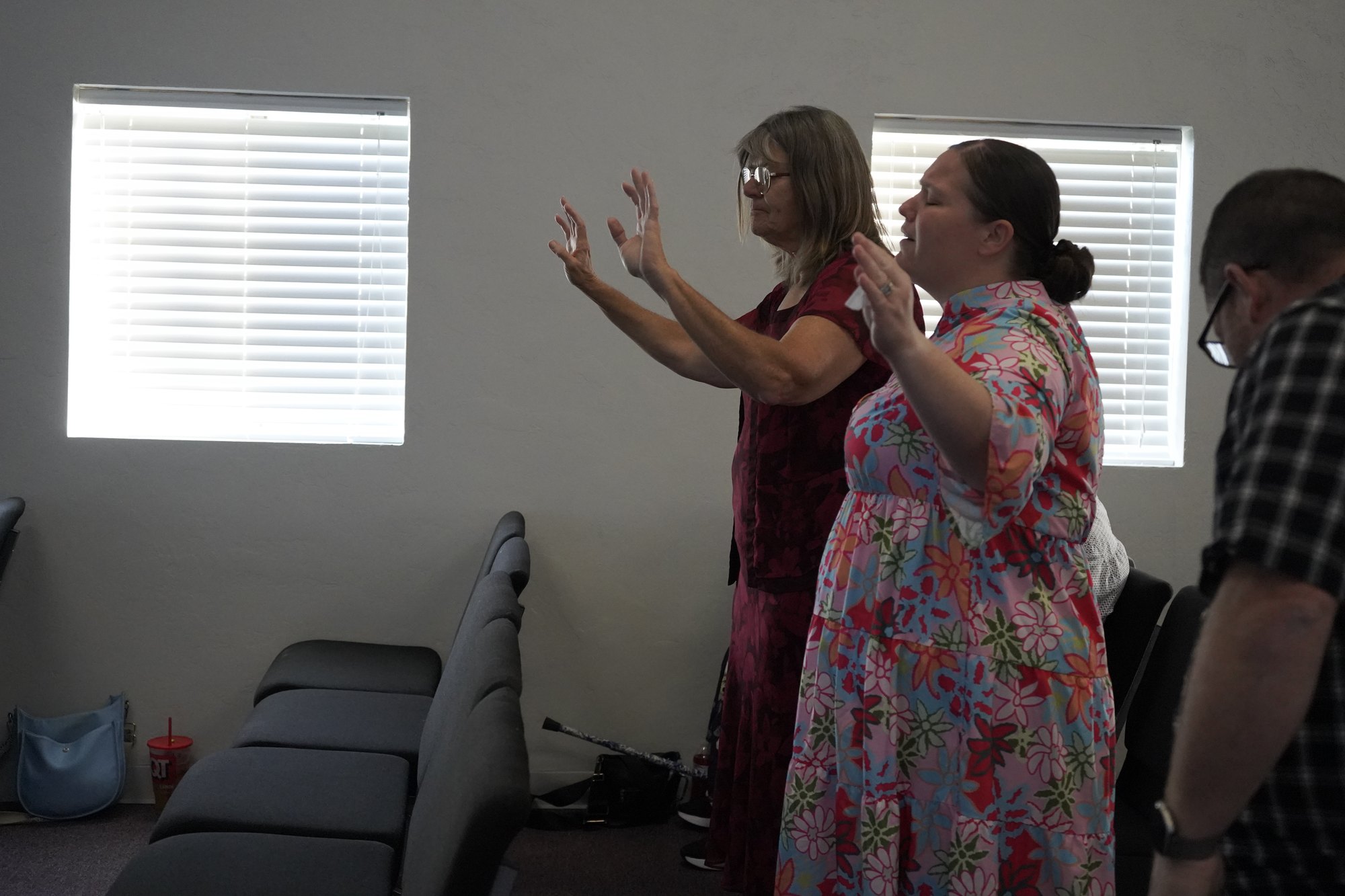 Sarah Chester worshiping and praying at Refuge Church