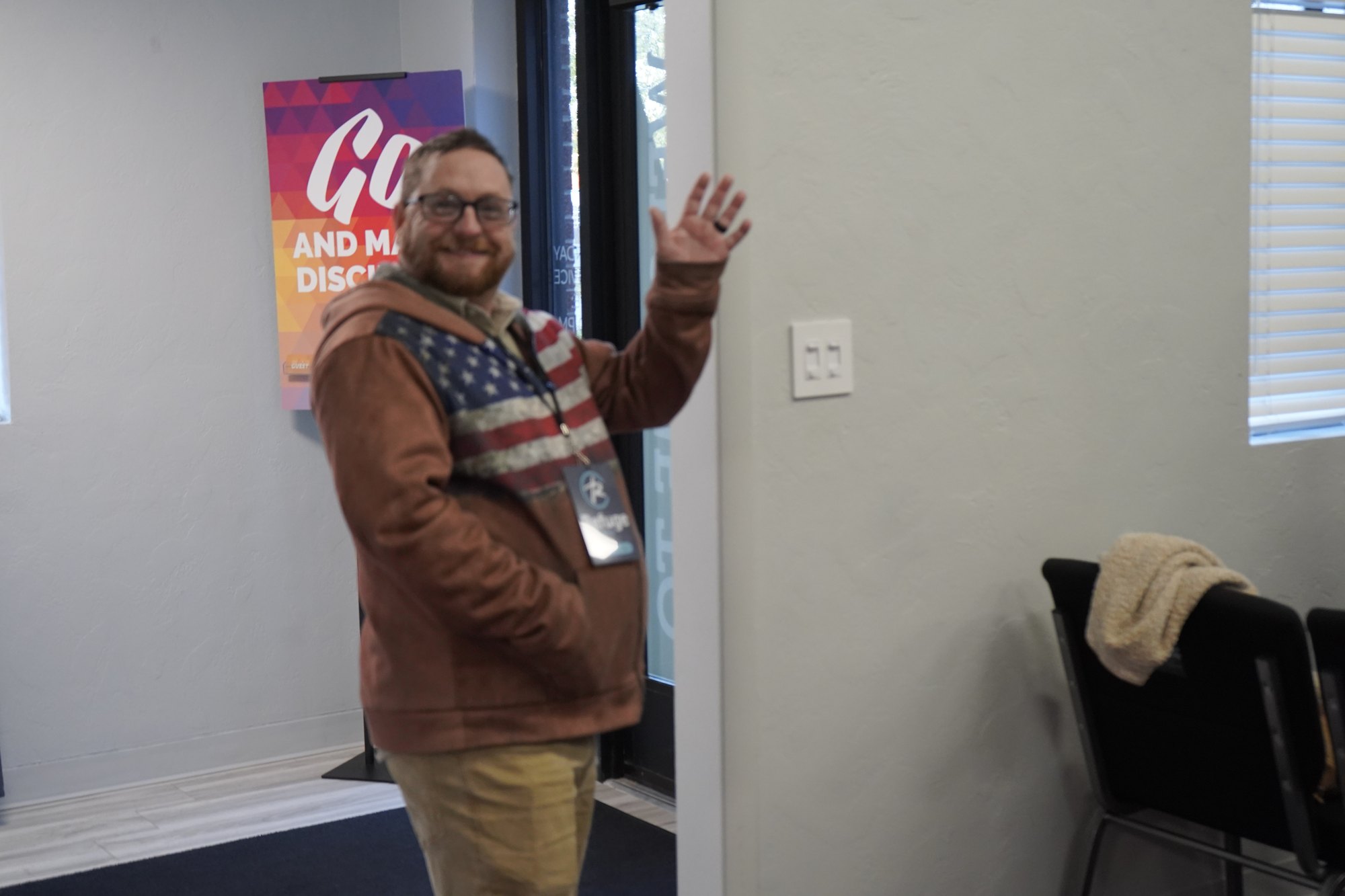 Will Galloway welcoming people at Refuge Church